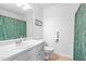 Clean bathroom featuring a sink, toilet, and shower with curtain at 3831 Abattoir Rd, Angier, NC 27501