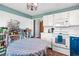 Kitchen featuring white cabinets, appliances and lighting at 3831 Abattoir Rd, Angier, NC 27501