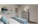 Bedroom featuring a serene palette, a modern dresser, and soft natural light at 40 Digging Time Ave, Princeton, NC 27569