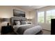 Bedroom with a large bed, side tables and windows for natural light at 40 Digging Time Ave, Princeton, NC 27569