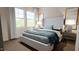 Bright bedroom with a large bed, side tables, and a large window at 40 Digging Time Ave, Princeton, NC 27569