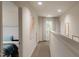 Bright hallway with natural light showcases art and leads to a bedroom with a glimpse of a bed at 40 Digging Time Ave, Princeton, NC 27569