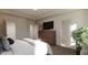 Spacious main bedroom with ample natural light, a large dresser, and neutral decor at 40 Digging Time Ave, Princeton, NC 27569