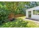 Well-maintained backyard with fence and large tree at 410 Willingham Rd, Morrisville, NC 27560