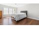 Sun-filled bedroom with hardwood floors and ceiling fan at 410 Willingham Rd, Morrisville, NC 27560