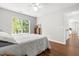 Bright bedroom with large window and hardwood floors at 410 Willingham Rd, Morrisville, NC 27560