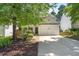 Charming home with a two-car garage, landscaped front yard, and a welcoming entrance at 410 Willingham Rd, Morrisville, NC 27560