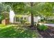 Home featuring a well-manicured lawn, beautiful landscaping, and a two-car garage at 410 Willingham Rd, Morrisville, NC 27560