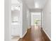 Hallway with an adjacent bathroom and hardwood floors at 410 Willingham Rd, Morrisville, NC 27560