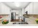 Bright kitchen boasts stainless appliances, tiled backsplash, and sleek countertops at 410 Willingham Rd, Morrisville, NC 27560