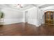 Bright living room featuring hardwood floors, white trim, and large windows at 410 Willingham Rd, Morrisville, NC 27560