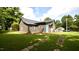 Back of house shows back entrance and partial driveway with stone pavers at 416 Everett St, Burlington, NC 27215