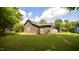 Spacious backyard with green grass and mature trees at 416 Everett St, Burlington, NC 27215