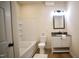 Full bathroom with shower-tub combo, stylish vanity, and modern fixtures, a linen closet is adjacent at 416 Everett St, Burlington, NC 27215