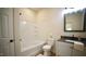 Clean bathroom with tub-shower combo, white subway tile surround, and modern vanity at 416 Everett St, Burlington, NC 27215