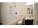 Modern bathroom features a tiled shower, dark vanity, and stylish fixtures at 416 Everett St, Burlington, NC 27215