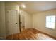 Cozy bedroom with hardwood floors and a window, featuring a closet and neutral paint at 416 Everett St, Burlington, NC 27215