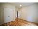 Bedroom features hardwood floors, closet, and neutral walls at 416 Everett St, Burlington, NC 27215