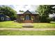 Charming home features a covered porch and a bright blue front door at 416 Everett St, Burlington, NC 27215