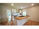 Kitchen with butcher block island, white cabinets, and stainless steel appliances at 416 Everett St, Burlington, NC 27215