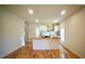 Open kitchen and dining area feature hardwood floors and modern finishes at 416 Everett St, Burlington, NC 27215