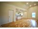 Spacious living room features hardwood floors and flows into the kitchen with an island at 416 Everett St, Burlington, NC 27215