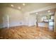 Open concept living room flows to kitchen; features high ceiling and hardwood floors at 416 Everett St, Burlington, NC 27215