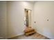 A landing leading to a kitchen and laundry area with a step-down feature at 416 Everett St, Burlington, NC 27215