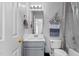 Bathroom with updated vanity, neutral walls and flooring, and updated fixtures at 4505 Woodlawn Dr, Raleigh, NC 27616
