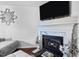 Close-up view of the fireplace, showcasing the marble surround and mantel at 4505 Woodlawn Dr, Raleigh, NC 27616