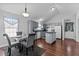This kitchen features gray cabinets, an island, an eat-in dining area with lots of light at 4505 Woodlawn Dr, Raleigh, NC 27616