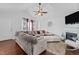 Open living room features a ceiling fan, fireplace, and ample seating at 4505 Woodlawn Dr, Raleigh, NC 27616