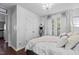 Spacious main bedroom featuring a walk-in closet and hardwood floors at 4505 Woodlawn Dr, Raleigh, NC 27616
