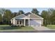 Charming single-Gathering home with gray siding, stone accents, and an attached two-car garage at 51 Digging Time Ave, Princeton, NC 27569