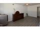 Well-lit bedroom featuring a ceiling fan and wood-look floors at 521 S Lombard St, Clayton, NC 27520