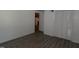 Bedroom featuring wood-look floors and closet doors at 521 S Lombard St, Clayton, NC 27520