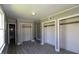 Bright bedroom with wood-look flooring and closet space at 521 S Lombard St, Clayton, NC 27520