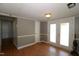 Versatile bonus room with neutral paint, hardwood floors and exterior patio access at 521 S Lombard St, Clayton, NC 27520
