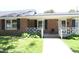 Charming brick ranch-style home with a cozy front porch and well-maintained landscaping at 521 S Lombard St, Clayton, NC 27520