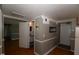Hallway leading to bathroom featuring wainscoting and access to the exterior at 521 S Lombard St, Clayton, NC 27520