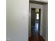 Hallway featuring wood-look floors with natural lighting at 521 S Lombard St, Clayton, NC 27520