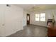 Living room with neutral paint, hardwood flooring, ceiling fan, and natural light at 521 S Lombard St, Clayton, NC 27520
