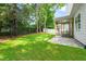 Spacious backyard featuring green lawn and access to covered porch at 525 Kings Lake Way, Durham, NC 27703