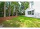 Manicured backyard with lawn and perimeter landscaping at 525 Kings Lake Way, Durham, NC 27703