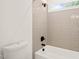 Modern bathroom featuring a tiled shower and a sleek, dark faucet and shower head at 525 Kings Lake Way, Durham, NC 27703