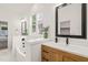 Modern bathroom with dual sinks, custom wood cabinets, and a soaking tub at 525 Kings Lake Way, Durham, NC 27703