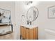 Stylish half-bathroom features modern fixtures and wood-look vanity at 525 Kings Lake Way, Durham, NC 27703