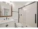 Updated bathroom featuring a glass-enclosed shower and modern fixtures at 525 Kings Lake Way, Durham, NC 27703