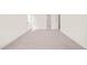 Spacious carpeted bedroom with white walls and trim, creating a clean and modern look at 525 Kings Lake Way, Durham, NC 27703