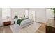 Bright bedroom features a large bed, modern decor, and hardwood floors at 525 Kings Lake Way, Durham, NC 27703